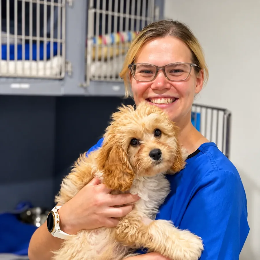 Jemima Squance holding a small dog